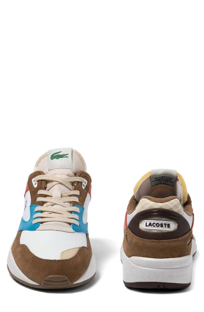 Shop Lacoste Storm 96 Low Leather Sneaker In Brown/ Blue