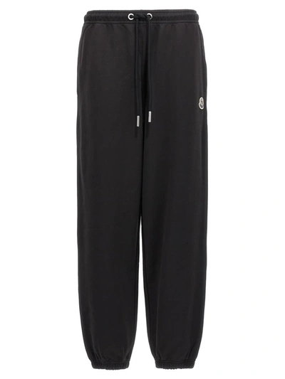 Shop Moncler Logo Patch Sweatpants In Black