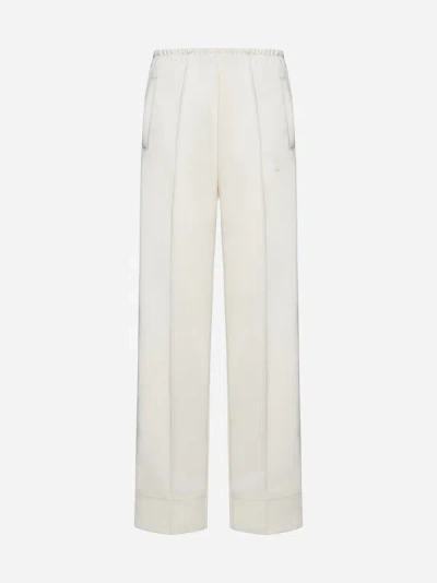 Shop Palm Angels Loose-fit Track Pants In Butter Off White
