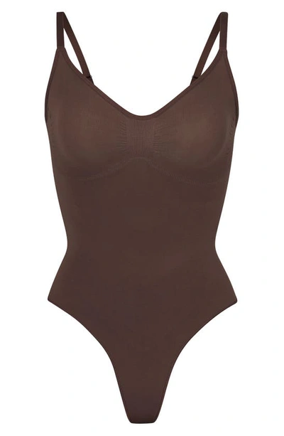 Shop Skims Seamless Sculpt Thong Bodysuit In Cocoa