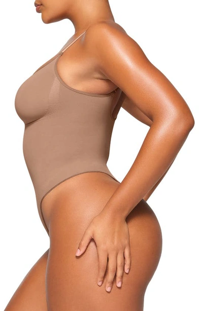 Skims Deep Plunge Strapless Thong Shapewear Bodysuit Thong Clay In Sienna