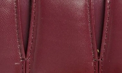 Shop Alexander Mcqueen Slash Cutout Knuckle Leather Clutch In 6000 Burgundy