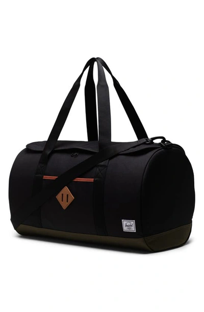 Shop Herschel Supply Co Heritage Duffle Bag In Black / Ivy Green / Chutney