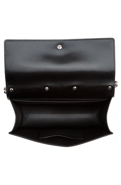 Shop Alexander Mcqueen Slash Cutout Knuckle Denim Crossbody Bag In 4290 Denim/ Black