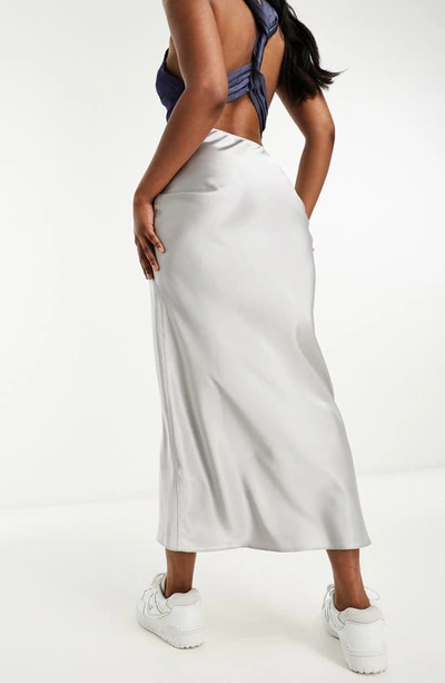 Shop Asos Design Bias Cut Satin Midi Skirt In Silver