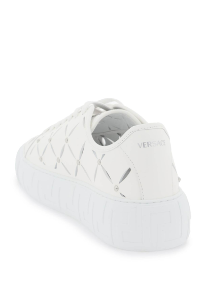 Shop Versace Greca Cut-out Sneakers Men In White