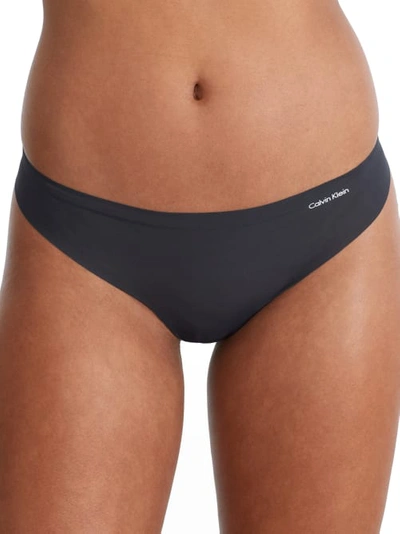 Shop Calvin Klein Invisibles Thong In Blue Graphite
