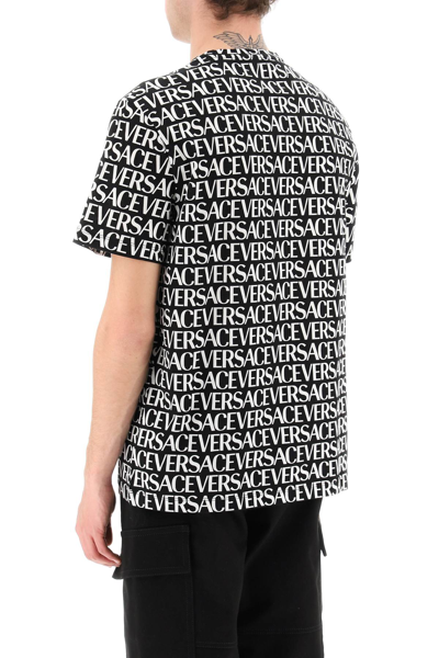 Shop Versace All-over Logo T-shirt Men In Multicolor
