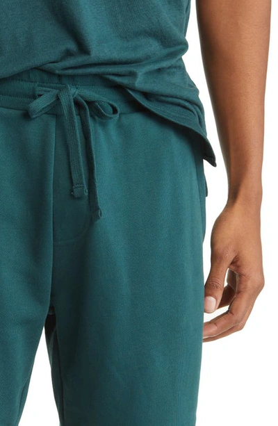 Shop Alo Yoga Chill Shorts In Midnight Green