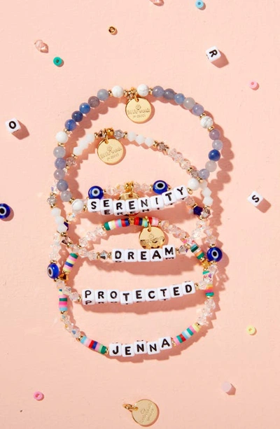 Shop Little Words Project Evil Eye Custom Beaded Stretch Bracelet In Crystal Blue