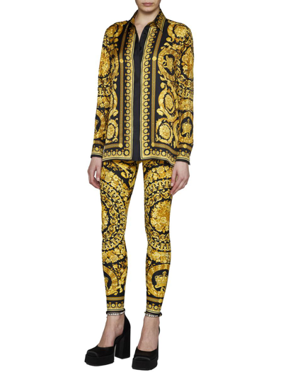 Shop Versace Trousers In Black+gold