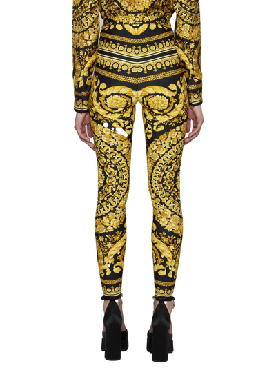 Shop Versace Trousers In Black+gold