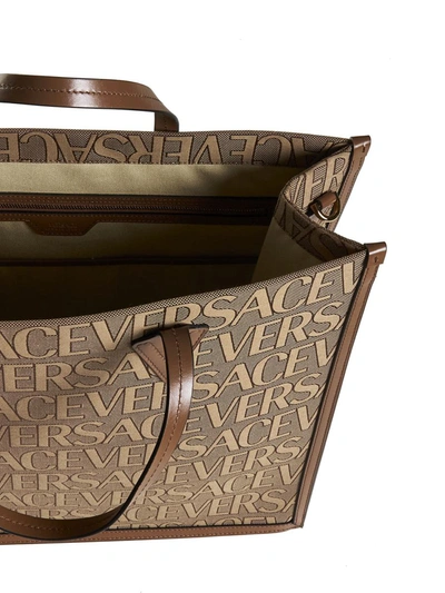Shop Versace Bags In Beige+brown-oro