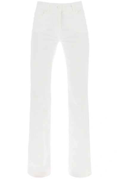 Shop Moschino Five Pocket Bootcut Jeans In White