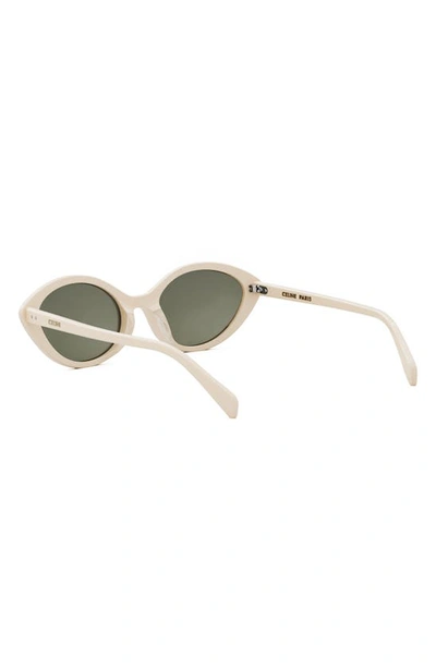 Shop Celine Cat Eye Sunglasses In Ivory / Green