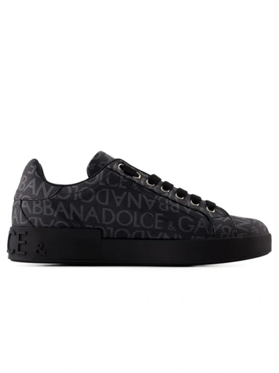Shop Dolce & Gabbana Coated Logo Sneakers - Canvas - Black