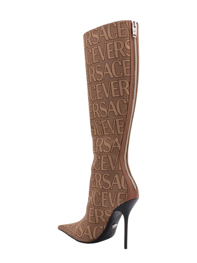 Shop Versace Canvas Boots With All-over Logo In Brown