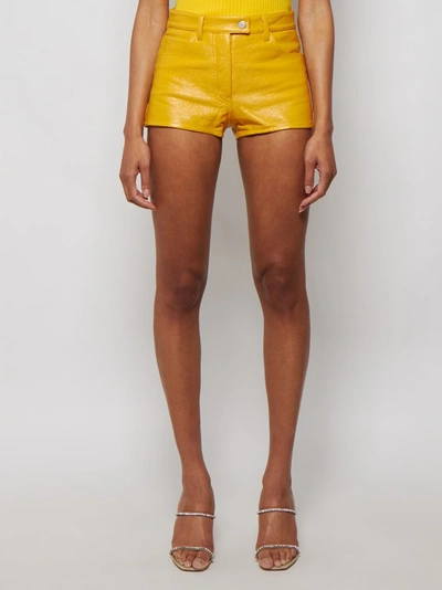 Shop Courrèges Coated Stretch Mini Shorts In Gold