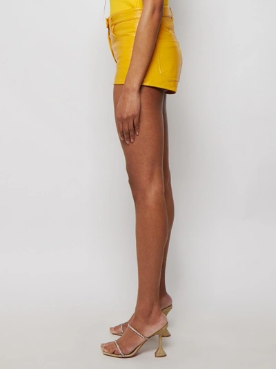 Shop Courrèges Coated Stretch Mini Shorts In Gold