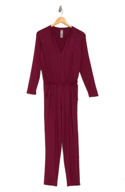 Shop Go Couture Split Neck Long Sleeve Jumpsuit In Burgundy