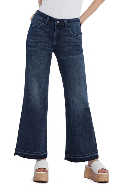 Shop Hint Of Blu Ruby Release Hem Relaxed Flare Leg Jeans In Deep Blue