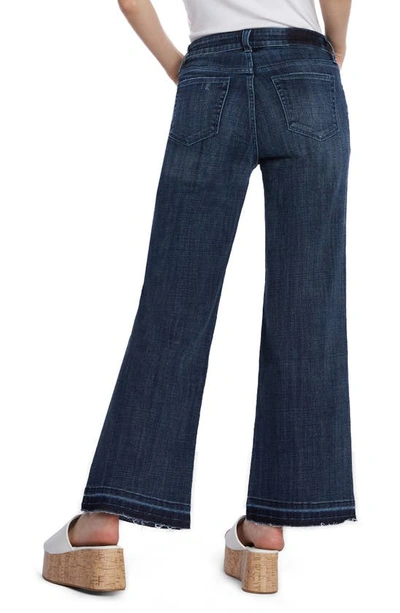 Shop Hint Of Blu Ruby Release Hem Relaxed Flare Leg Jeans In Deep Blue