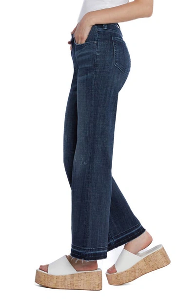 Shop Hint Of Blu Ruby Release Hem Relaxed Flare Leg Jeans In Deep Blue
