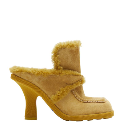 Shop Burberry Suede-shearling Highland Mules 90 In Yellow