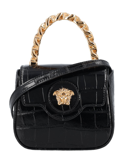 Shop Versace La Medusa Embossed Mini Bag In Black