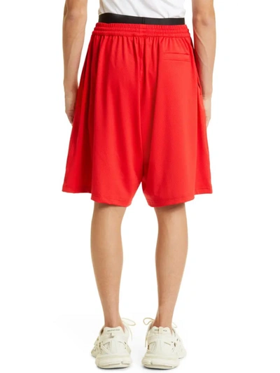 Shop Balenciaga Elasticated Waist Logo Swim Shorts In Red