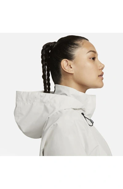 Shop Nike Swift Storm-fit Running Jacket In Pale Ivory/ Black