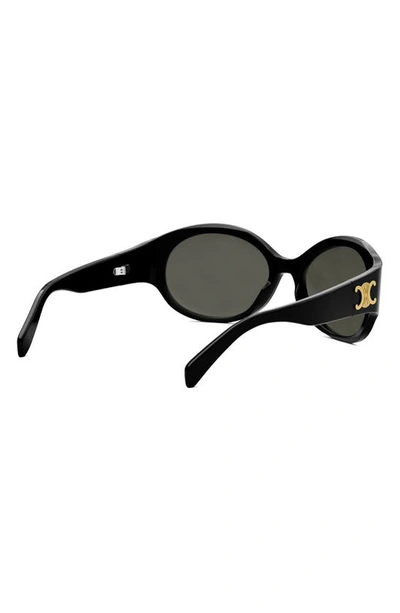 Shop Celine Triomphe Oval Sunglasses In Shiny Black / Smoke