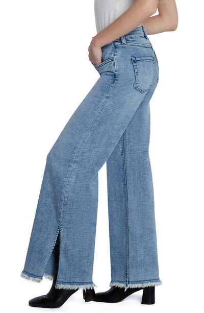 Shop Hint Of Blu Frayed Split Hem Mid Rise Wide Leg Jeans In Split Blue