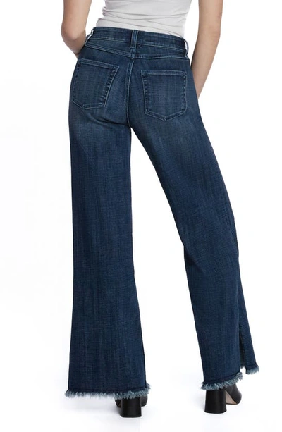 Shop Hint Of Blu Frayed Split Hem Mid Rise Wide Leg Jeans In Market Blue