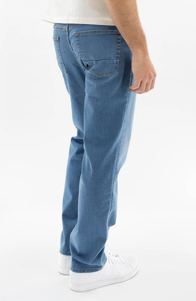 Shop Devil-dog Dungarees Slim Straight Leg Performance Jeans In Blue Rock