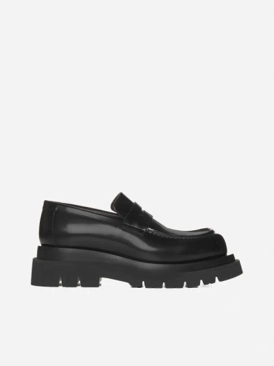 Shop Bottega Veneta Lug Leather Loafers In Black