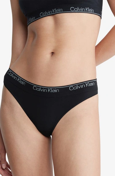 Shop Calvin Klein Naturals Modern Seamless Thong In Black