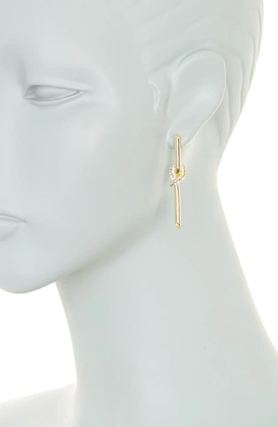 Shop Covet Pavé Crystal Knot Linear Drop Earrings In Gold