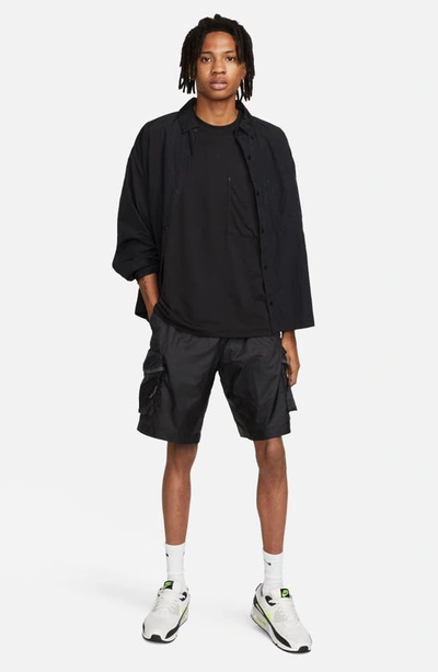Shop Nike Sportswear Tech Pack Dri-fit Oversize Pocket T-shirt In Black/ Black/ Black