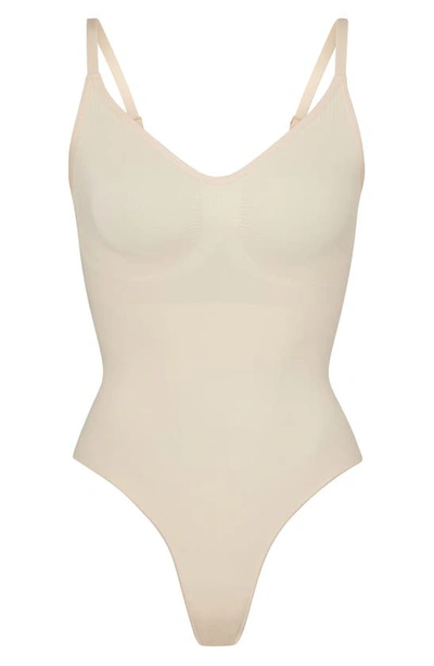 Shop Skims Seamless Sculpt Thong Bodysuit In Sand