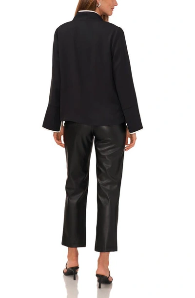 Shop Vince Camuto Trim Split Neck Top In Rich Black