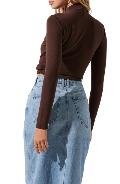 Astr Asymmetric Pleated Cutout Mock Neck Long Sleeve Top In Espresso