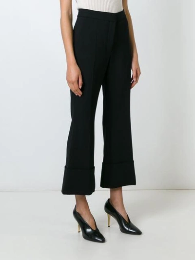 Shop Stella Mccartney Cropped Flared Trousers - Black