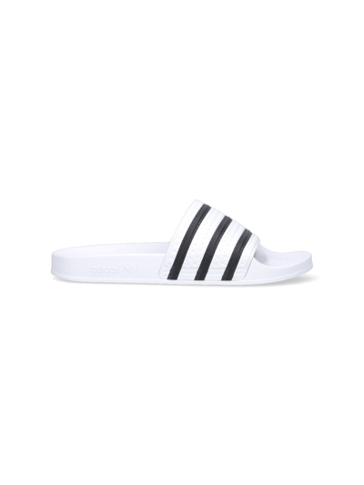 Shop Adidas Originals Logo Slide Sandals In White