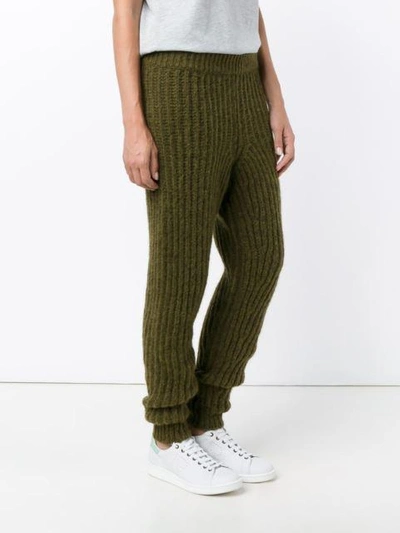 Shop Jw Anderson Ribbed Knit Trousers In Green