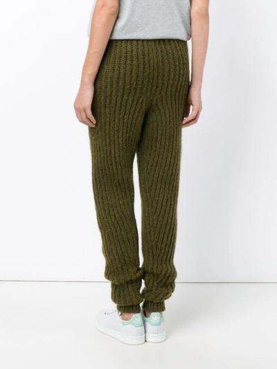 Shop Jw Anderson Ribbed Knit Trousers In Green