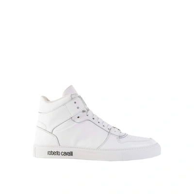 Shop Roberto Cavalli Logo Embossed Hi-top Sneakers In White