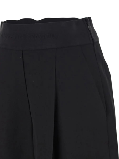 Shop Alexander Wang Logo Waistband Pleated Trousers In Nero