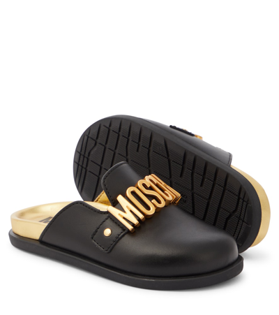 Shop Moschino Logo Leather Mules In Black