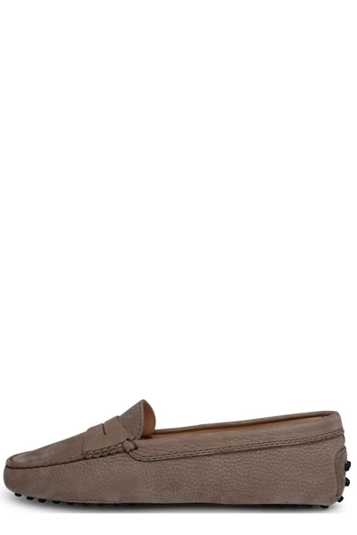 Shop Tod's Gommino Almond Toe Loafers In Beige